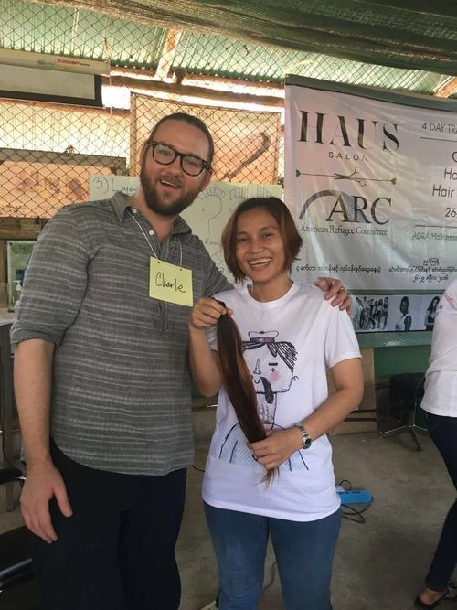 At Nu Po Refugee Camp: Phadkaew poses with Charlie from Haus Salon after he cut 1.5 feet of her hair! She’s donating the hair to be made into a wig for a cancer patient.